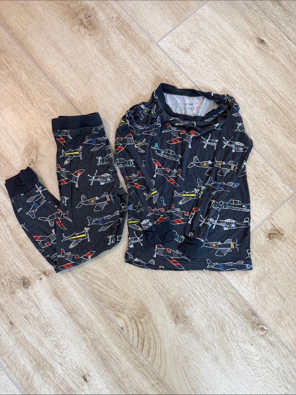 Little Sleepies Black Airplane Pajama Set with Red, Yellow, Blue & Green Accents